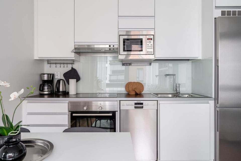 The apartment’s efficient flow makes it easy to move between the social spaces and private amenities.