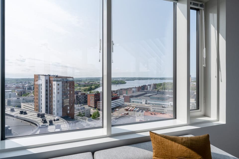 Aerial perspective of the urban landscape, railway connections, and the modern skyline of Tampere.