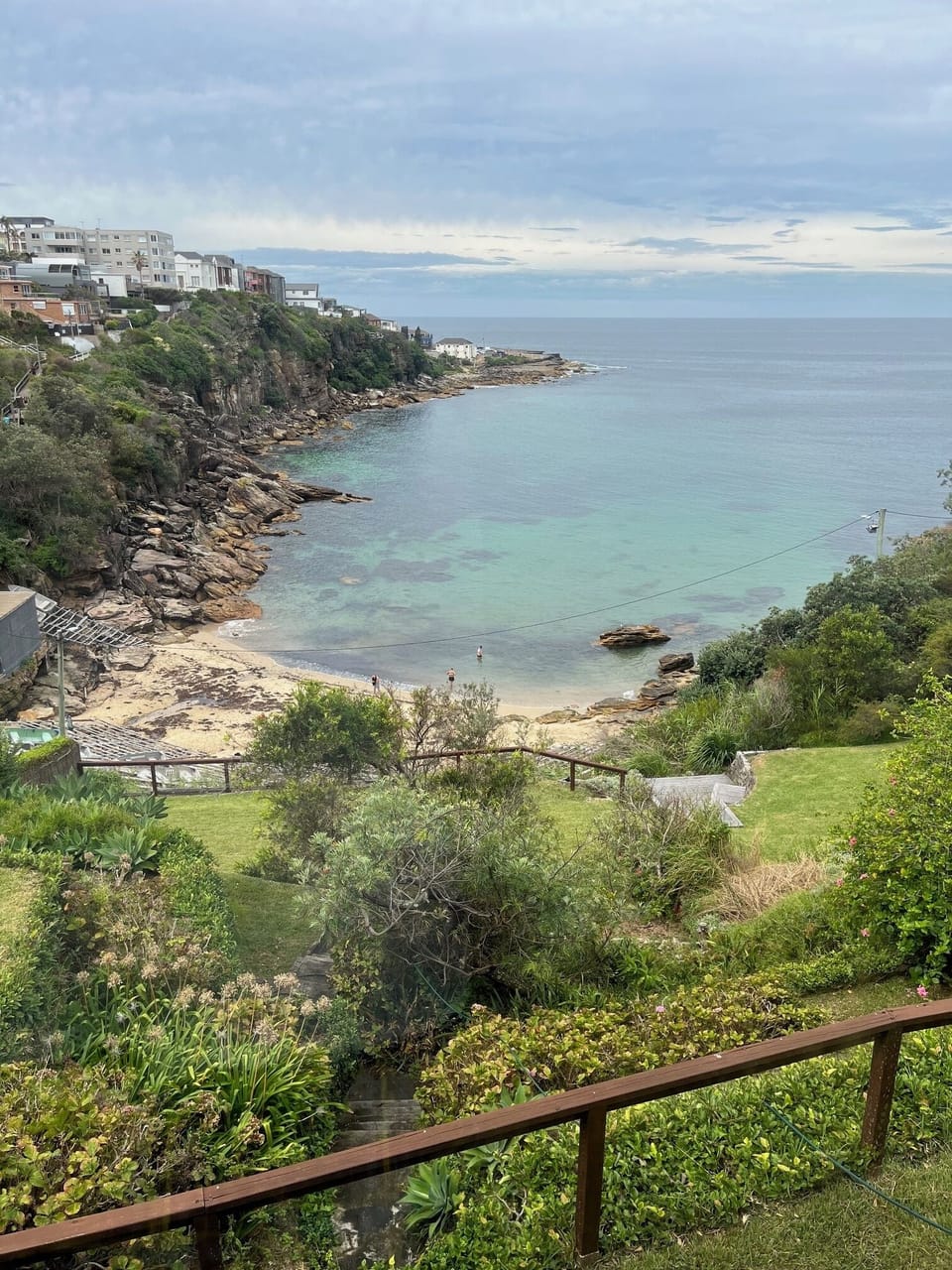 View of the garden and beach from the apartment. Favorite fence for Kookaburras