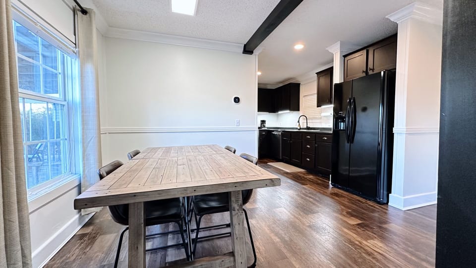 Enjoy meals at the cozy table for four in this dining room. 