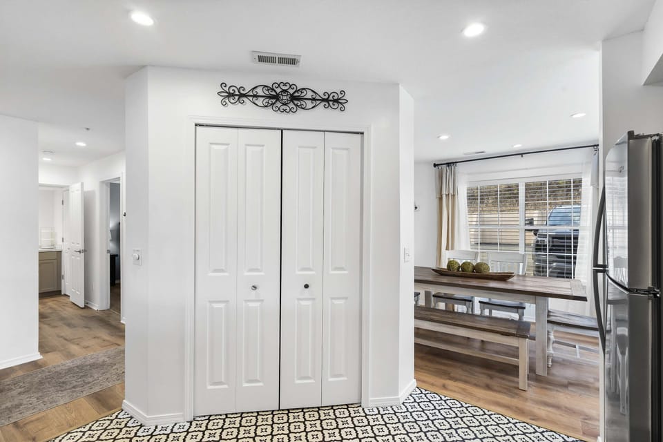 The sleek, open kitchen offers ample space & every home comfort