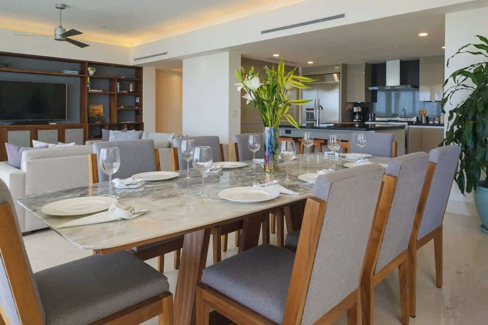The dining area, is next to the kitchen, living room, and terrace.