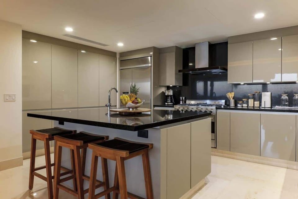 A fully equipped kitchen with a kitchen island.