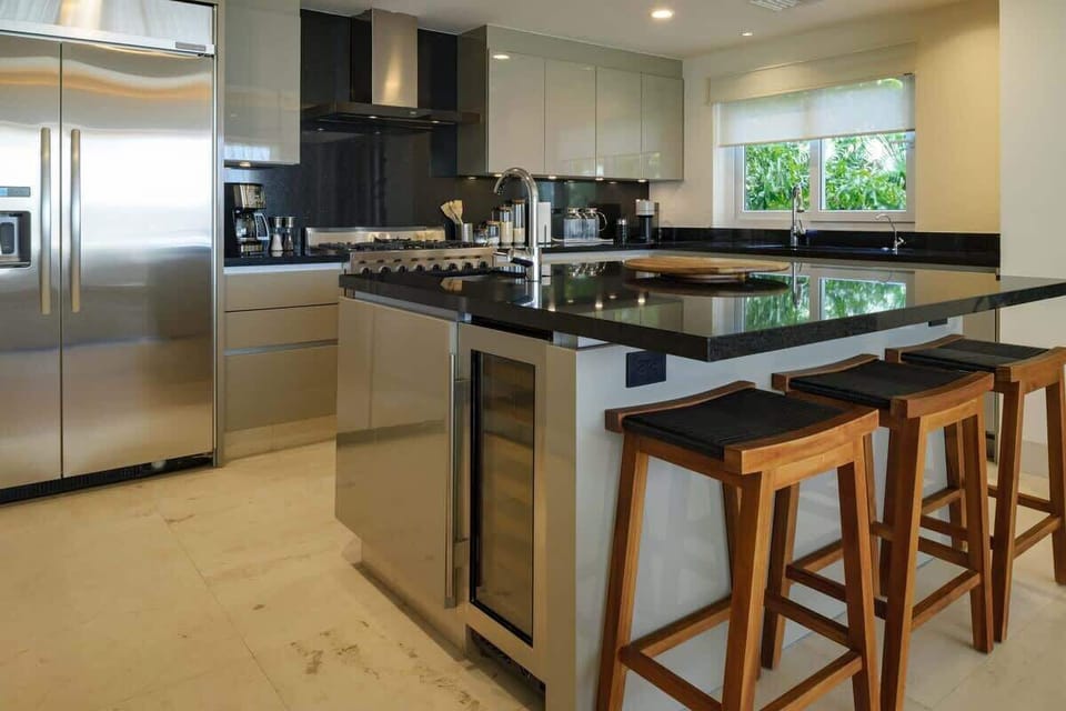 A fully equipped kitchen with a kitchen island.