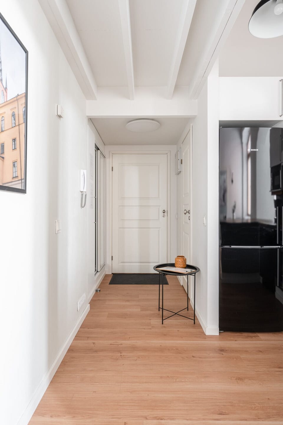 Step into a secure and private entryway that immediately welcomes you into this unique historic home. There is ample space right by the door to hang your coats and store your shoes neatly.