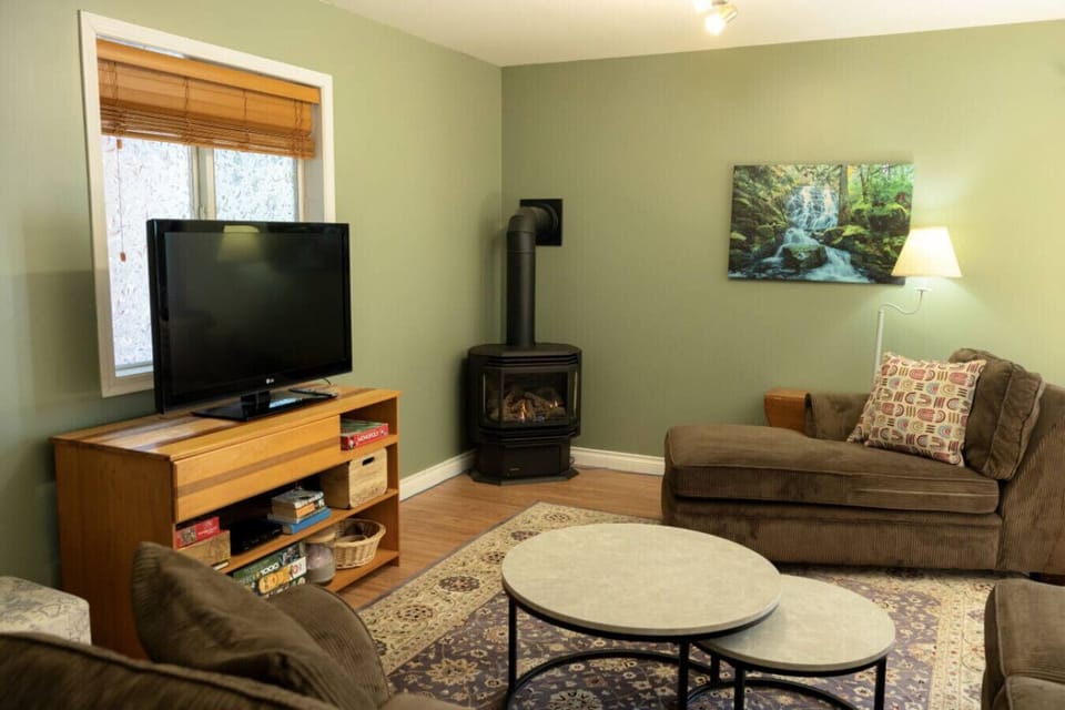 A fireplace in the living area adds warmth and relaxation to your stay