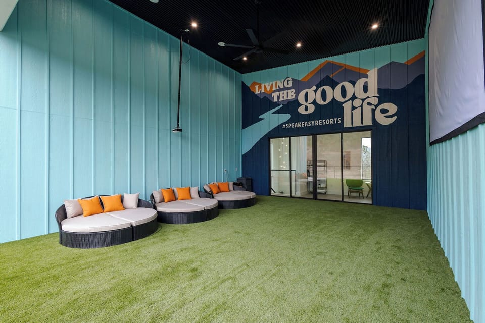 Kick off your shoes and get cozy in our outdoor movie room with 200" movie screen.