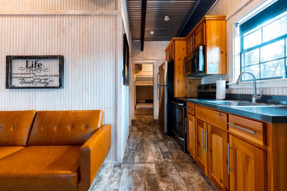 Triplet kitchen / living area and entrance to bedroom