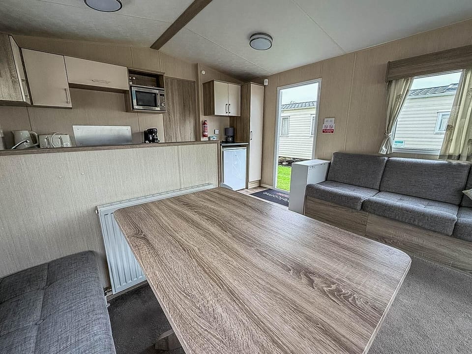 Discover the perfect family holiday UK experience at Kessingland Beach Holiday Park Suffolk, where Parkdean Resorts Kessingland Beach offers cosy caravan holidays UK with a comfortable kitchen area of a caravan for your convenience.