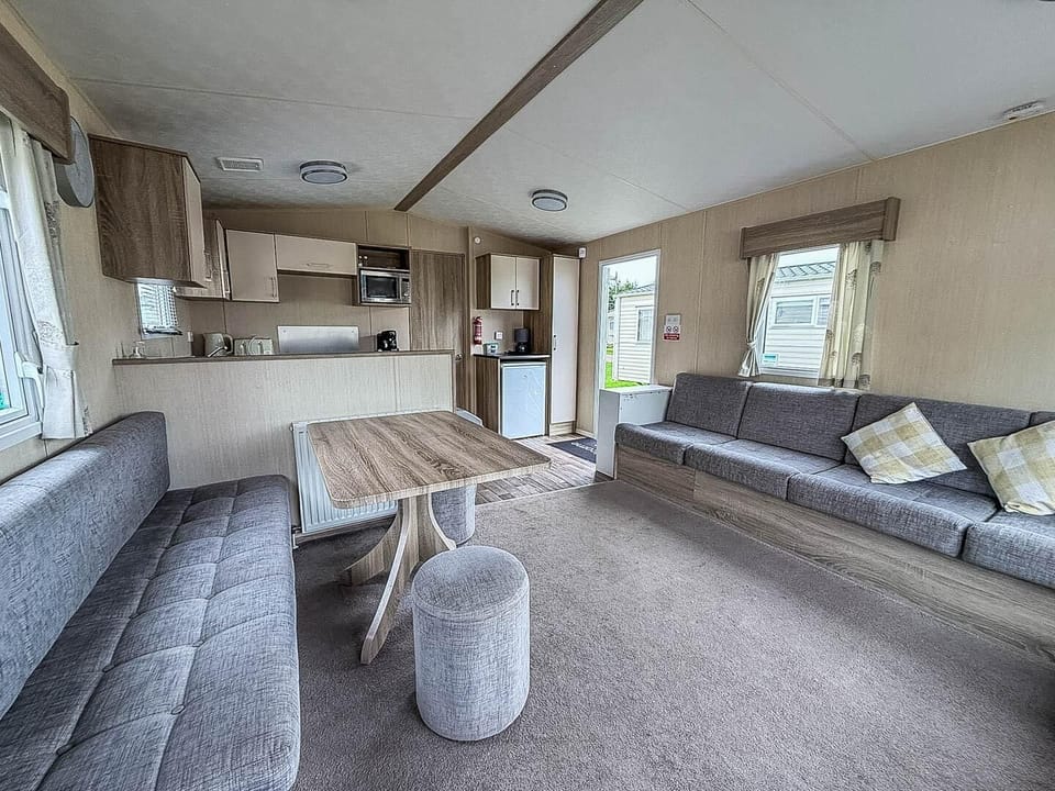 Kessingland Beach Parkdean offers unforgettable static caravan holidays, complete with a comfortable living room in a caravan, making it an ideal spot for short stays with your loved ones.
