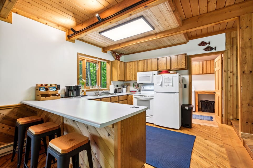 Kitchen peninsula counter area with stools
