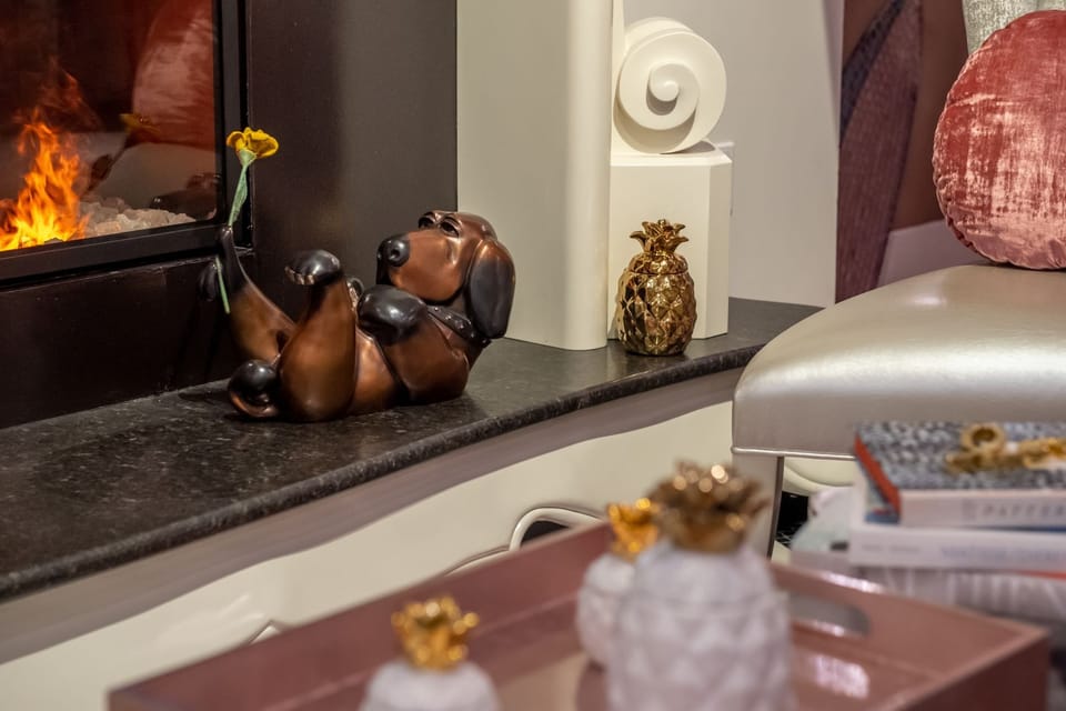 Cozy up by the glowing fireplace for a warm evening.