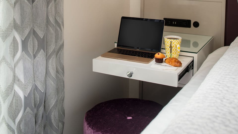 Settle in with a convenient desk for focused, cozy work.