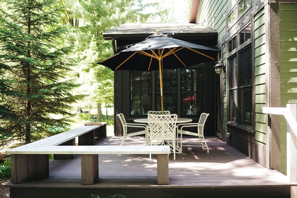 Main living area opens to a side deck with built-in seating
