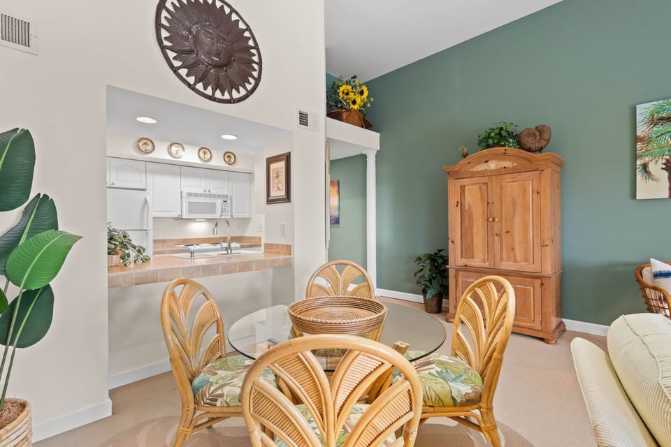 The dining area has a table with seating for four.