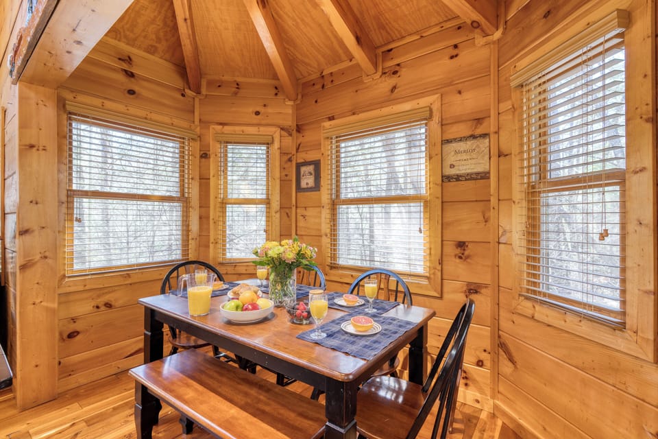 Dining area surrounded by windows.