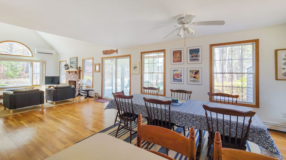 Dining area with slider to sun room and living room beyond