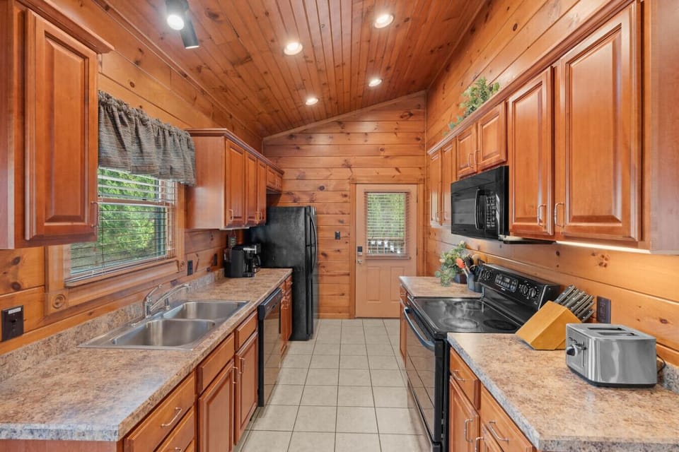 This fully equipped kitchen has everything you need—from modern appliances to ample counter space—making meal prep a breeze during your stay.