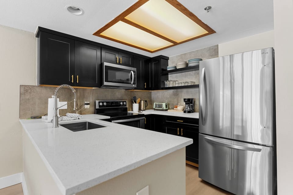 Upgraded kitchen with stainless steel appliances.