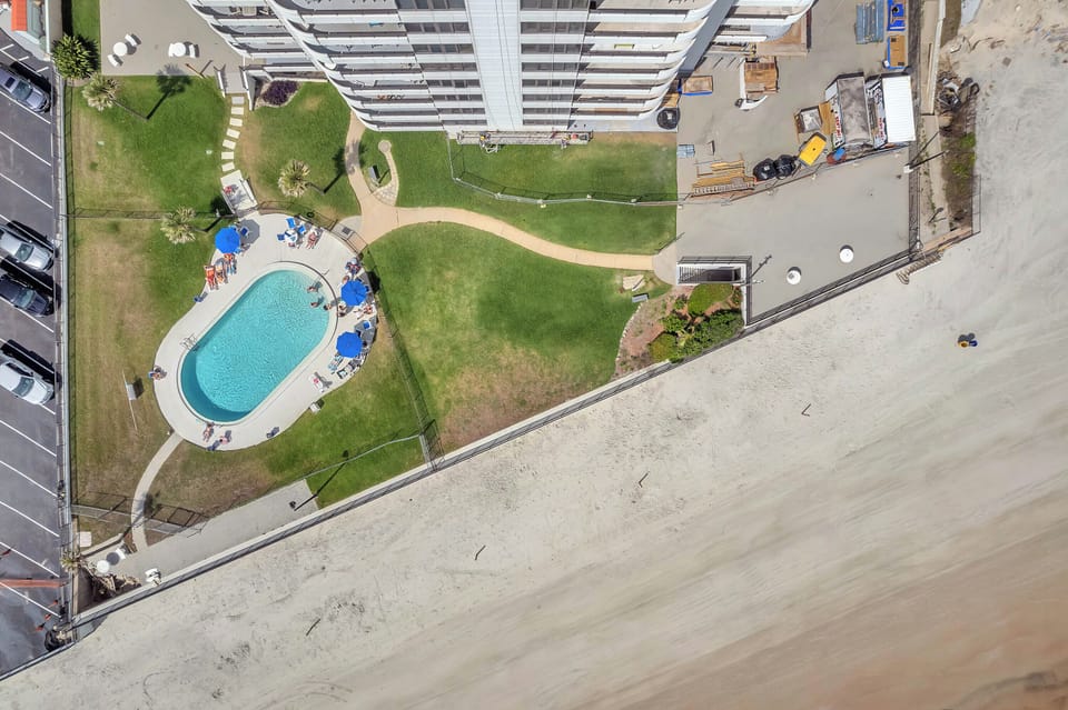 Beachfront pool with sun deck. Steps to beach have been restored. 