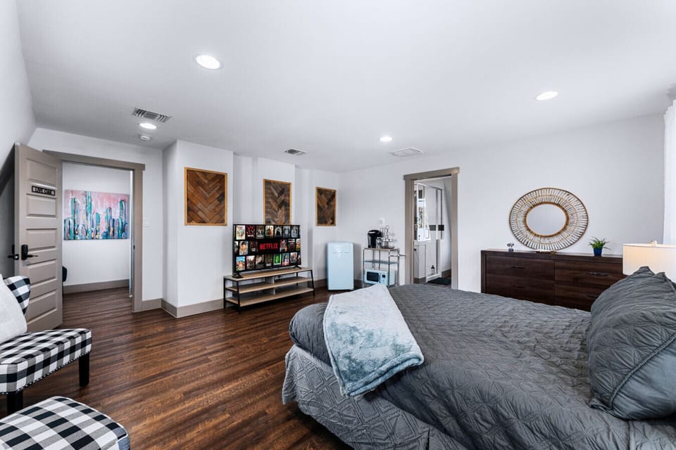 Large one bedroom suite with queen sized bed and attached bathroom