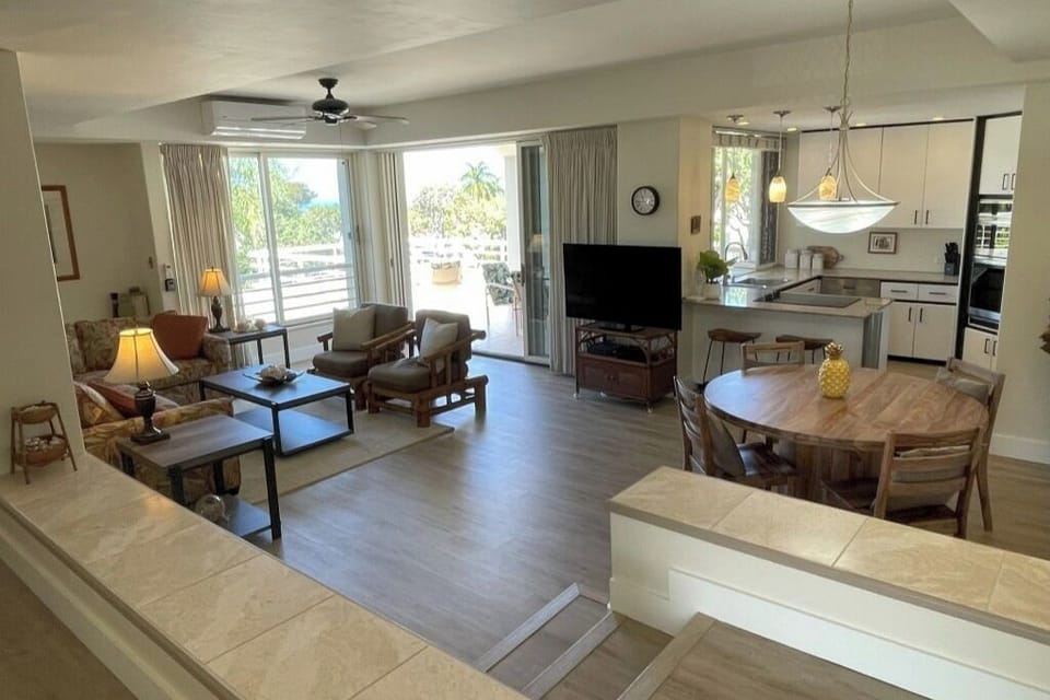 Living room opens up to large lanai with partial ocean view
