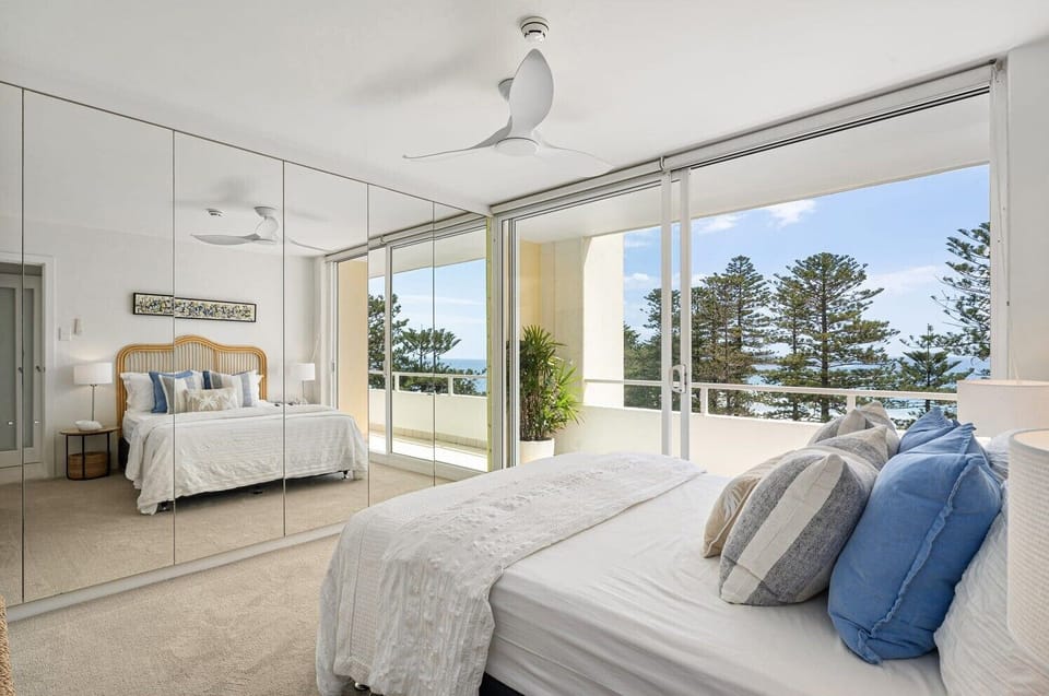 Main bedroom with ocean views, queen bed
