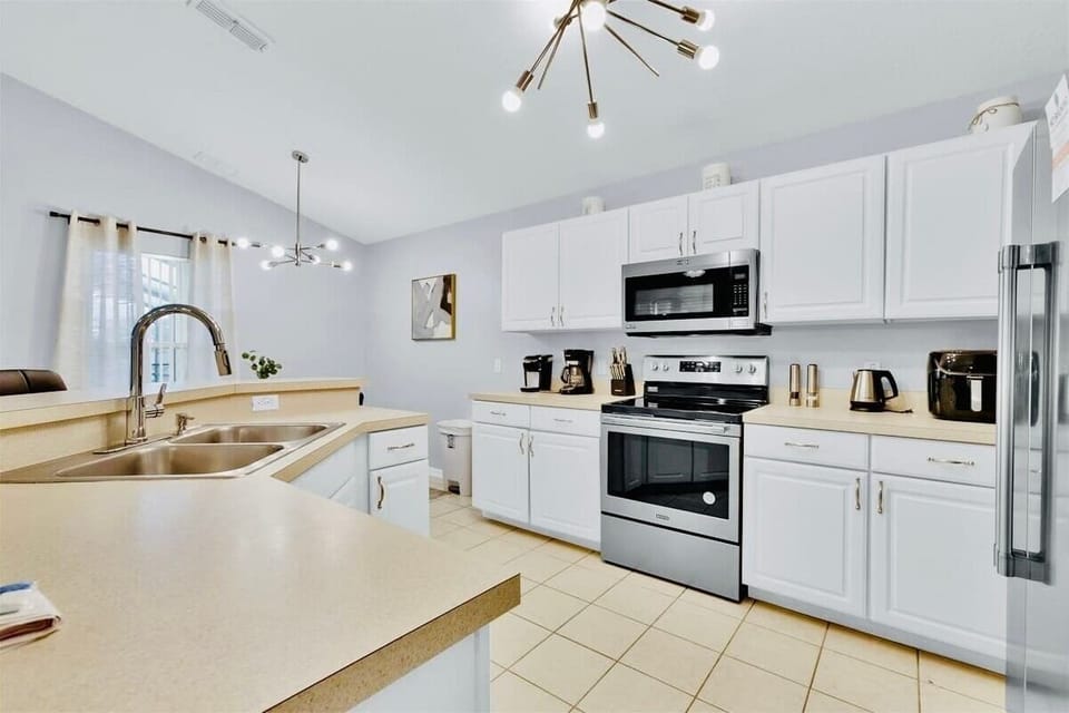 Fully stocked kitchen with cooking and dining essentials, spices, salt, pepper, coffee and tea