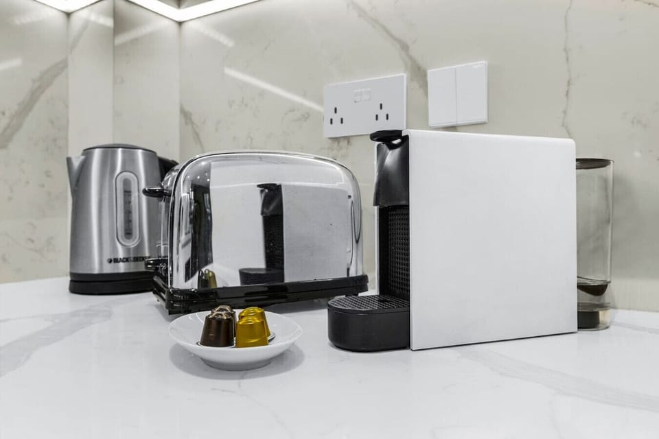 Kitchenette: Sip your morning coffee with style and enjoy modern appliances at your fingertips!
