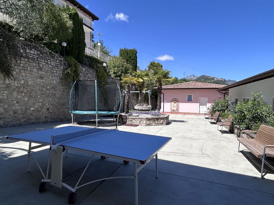 Racquet Sport, Outdoor Furniture, Mountain Range, Shade, Chair, Outdoor Table, Courtyard, Net, Outdoor Structure, Swimming Pool