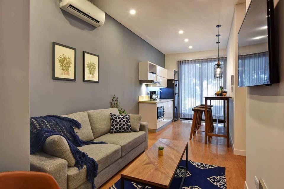 Comfortable layout with A/C SmartTV and easy access to your private balcony. A blackout has since been installed behind the curtain so you can block out all light if needed. 