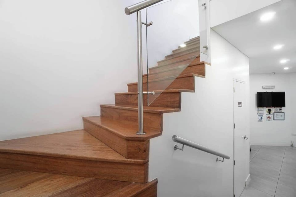 Hallway with staircase up to the 2nd floor. The building has no elevator. 