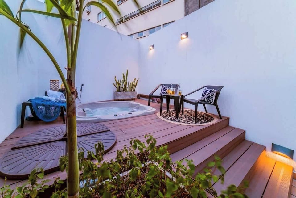 Private jacuzzi in the back of the terrace. Since this picture was taken a tarp or cover has been installed for increased privacy. We change the water and chemicals between every single check-in.