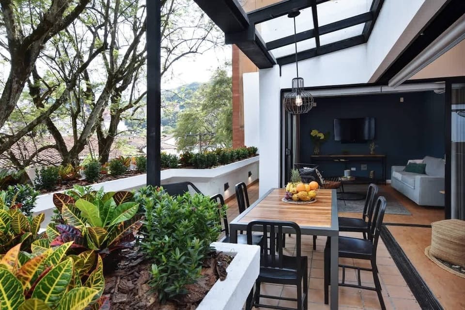 Outdoors dining under pergola ensuring that you can enjoy dinner even if it rains.