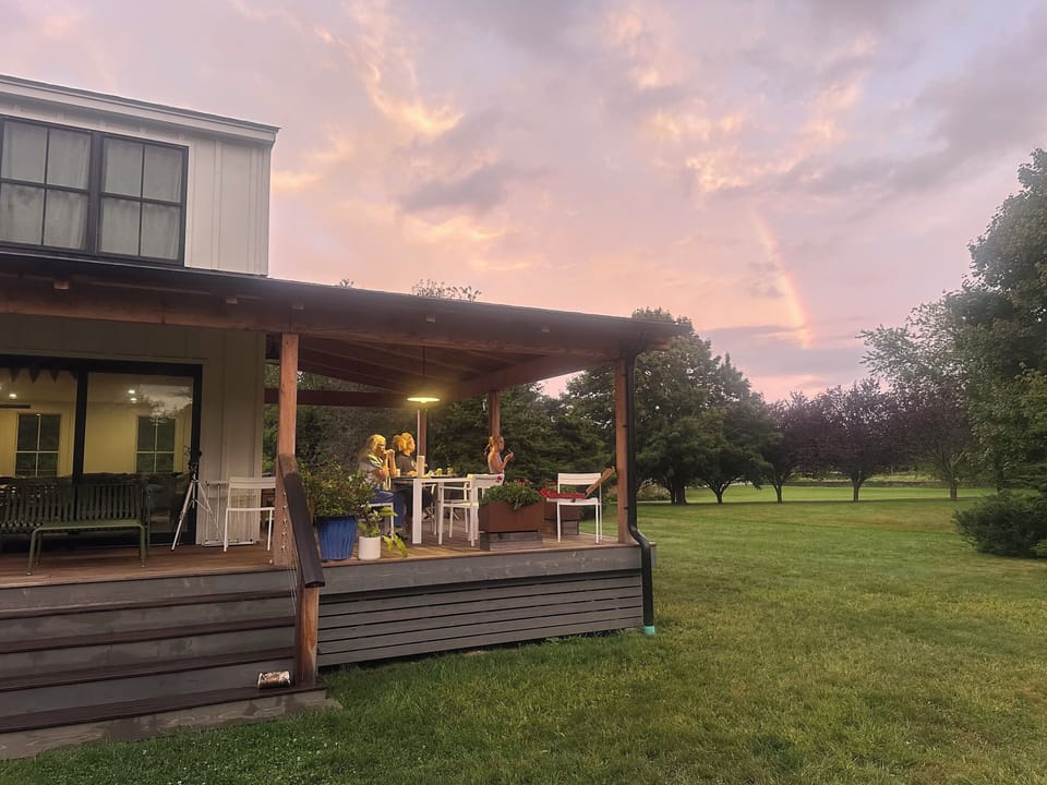 Gather on the deck at sunset -- outdoor dining and lounging with meadow views