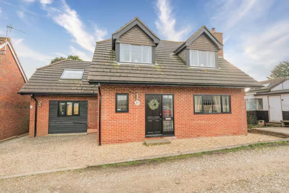 Full view of the property with private access and driveway