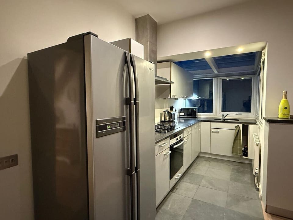 Full kitchen with modern appliances and ample counter space