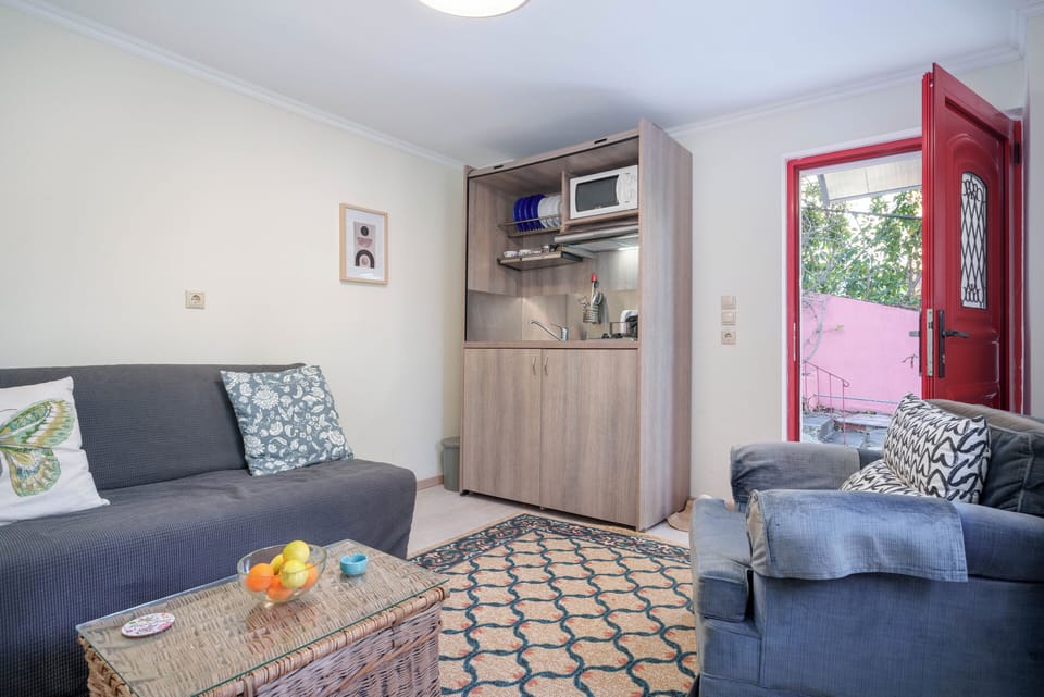 Living room with sofa bed and kitchenette