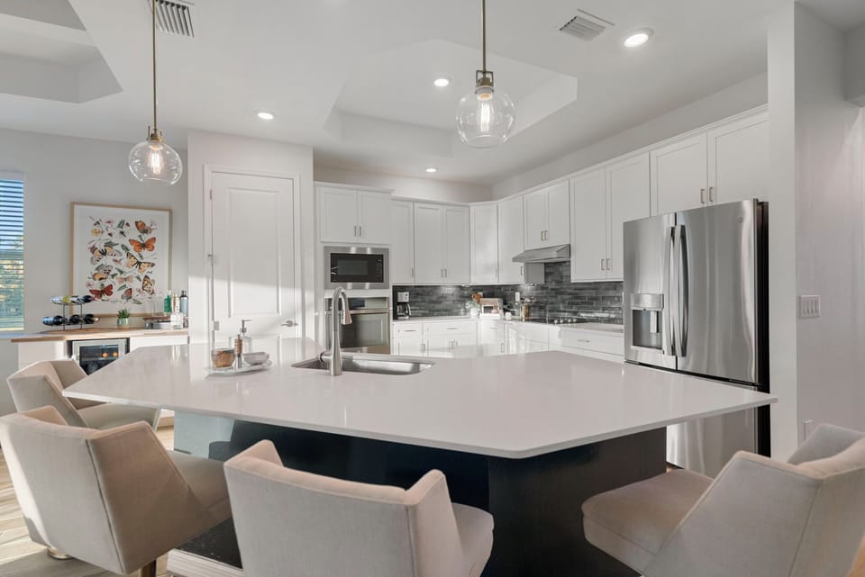 Island with chairs in kitchen