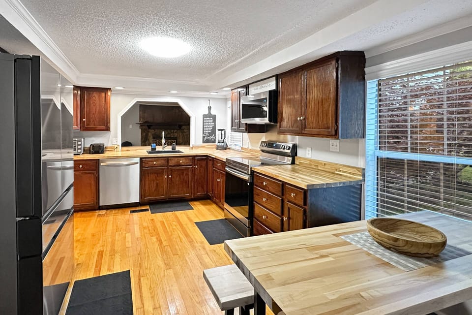 Large fully stocked kitchen with ample dishes, pots and pans, etc. for large groups