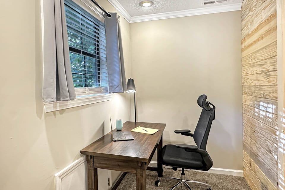 Need to jump on a quick conference call, enjoy this private office space with outside view of the woods