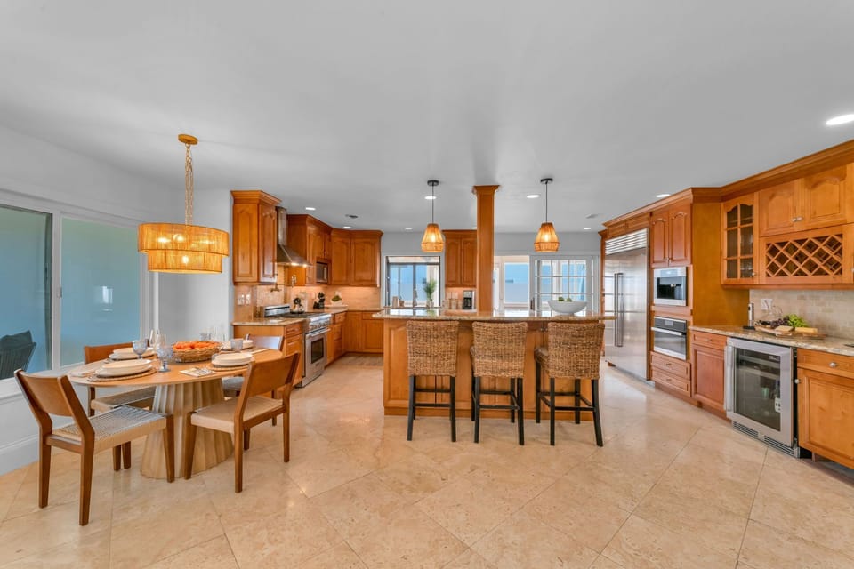 Experience a high-end chef’s kitchen with luxury finishes, a Sub-Zero fridge, Thermador appliances, and an espresso machine for the perfect start to your day.