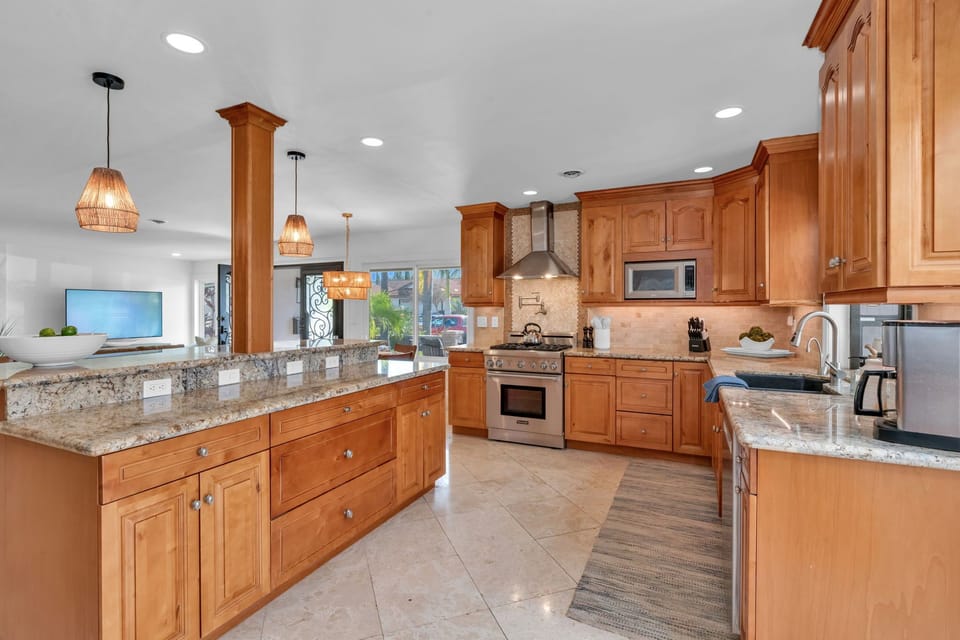 Experience a high-end chef’s kitchen with luxury finishes, a Sub-Zero fridge, Thermador appliances, and an espresso machine for the perfect start to your day.
