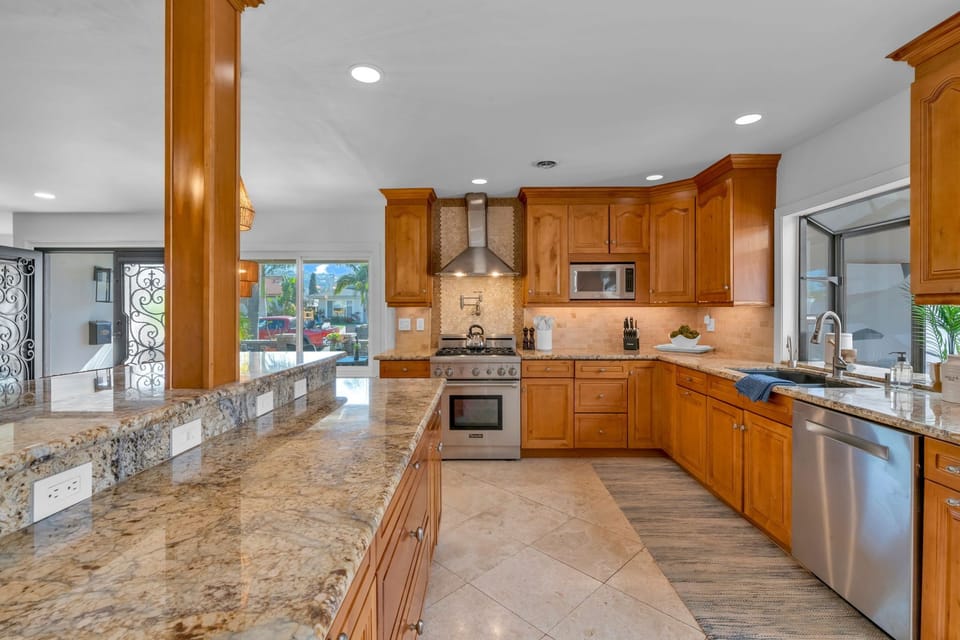 Experience a high-end chef’s kitchen featuring luxury finishes, a Sub-Zero refrigerator, Thermador appliances, and an espresso machine for the perfect start to your day