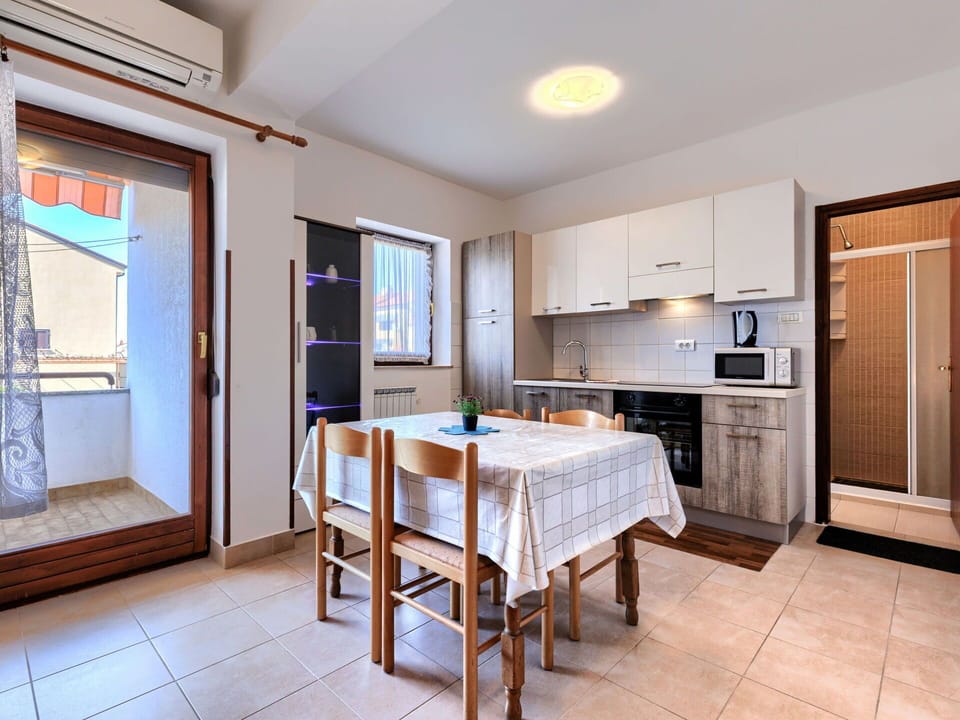 Flooring, Interior Design, Floor, Apartment, Balcony, Ceiling, Condominium, Chair, Shade, Porch