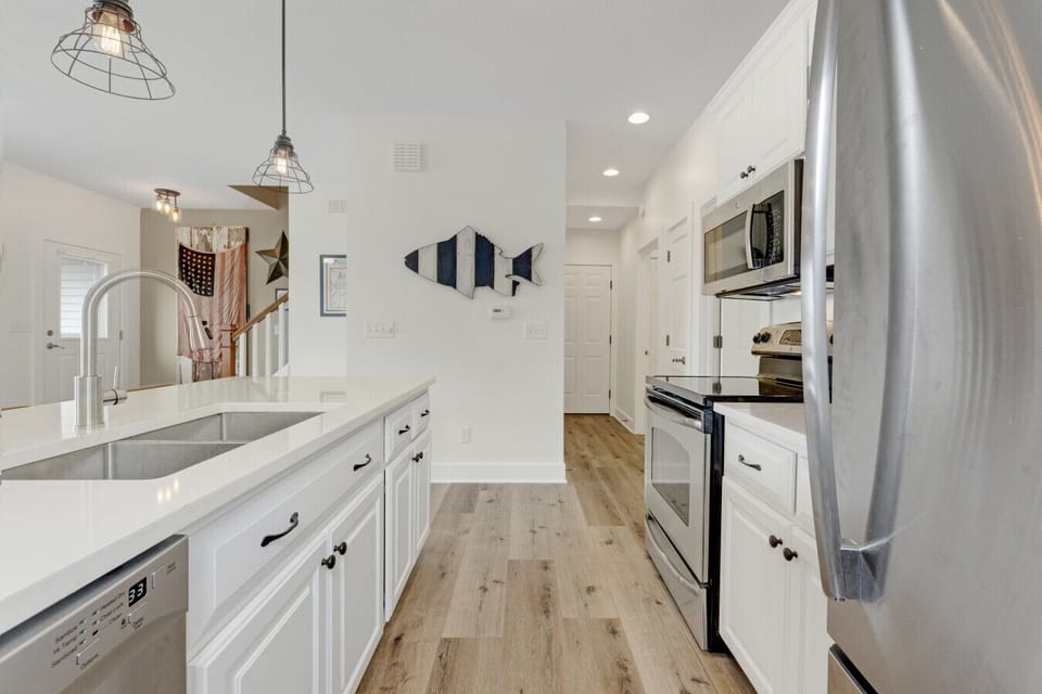 The fully equipped kitchen includes all the essentials for cooking, dining, and enjoying your stay with ease.