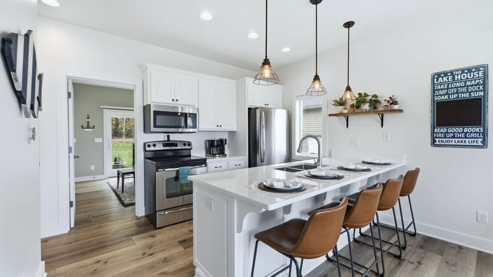 The newly renovated kitchen features modern updates and everything you need to cook, gather, and relax.