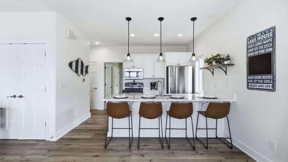 The newly renovated kitchen features modern updates and everything you need to cook, gather, and relax.