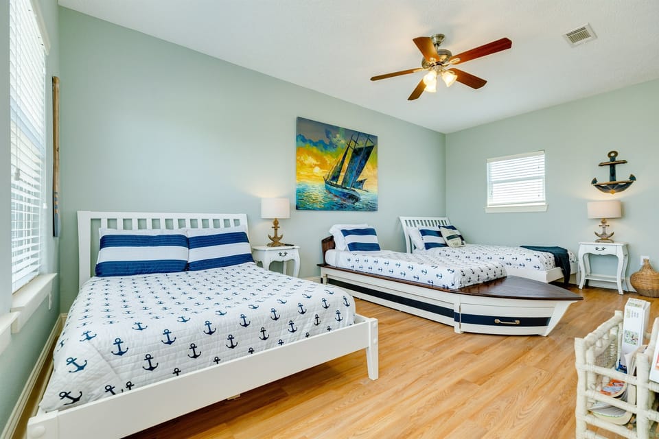 The anchor room has plenty of sleeping spaces for the family with 2 Full beds a boat-shaped Twin bed and a tucked-away Twin trundle built into the boat bed.