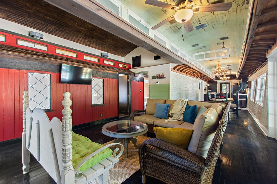 Family Room and TV.  Outside of one Train car that is bedroom 1